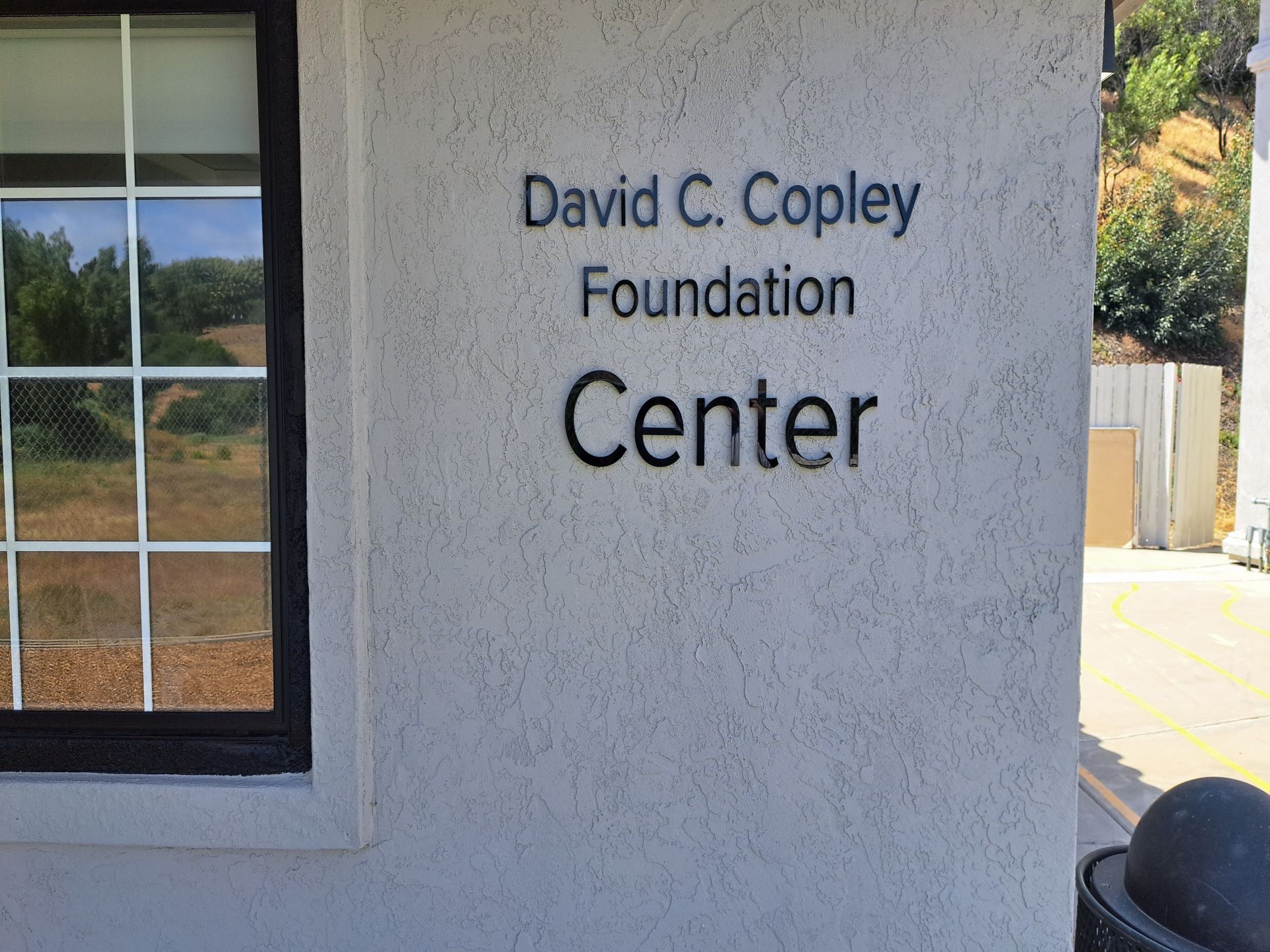 David C. Copley Foundation Center sign on a stucco building wall