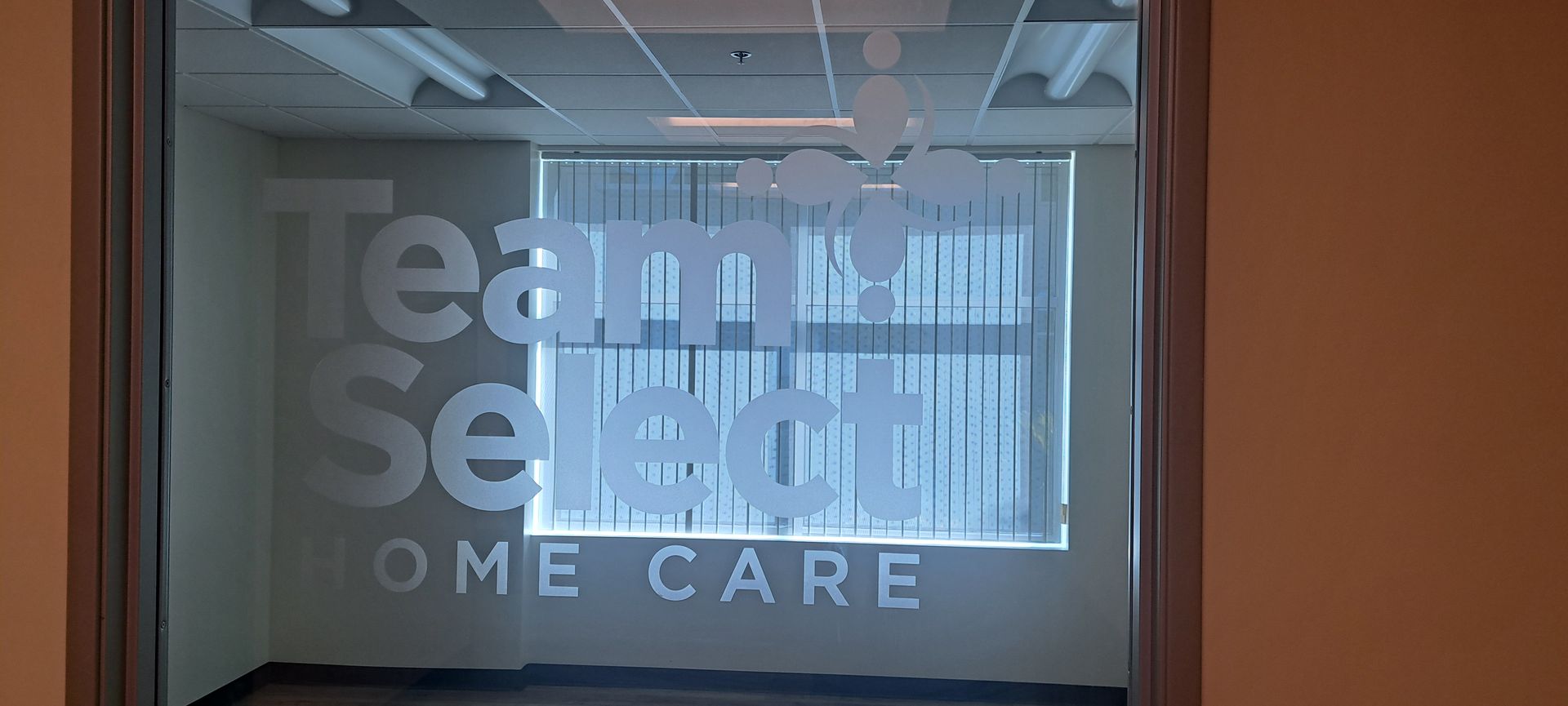Office window logo reading “teamSelect” with “HOME CARE” beneath it