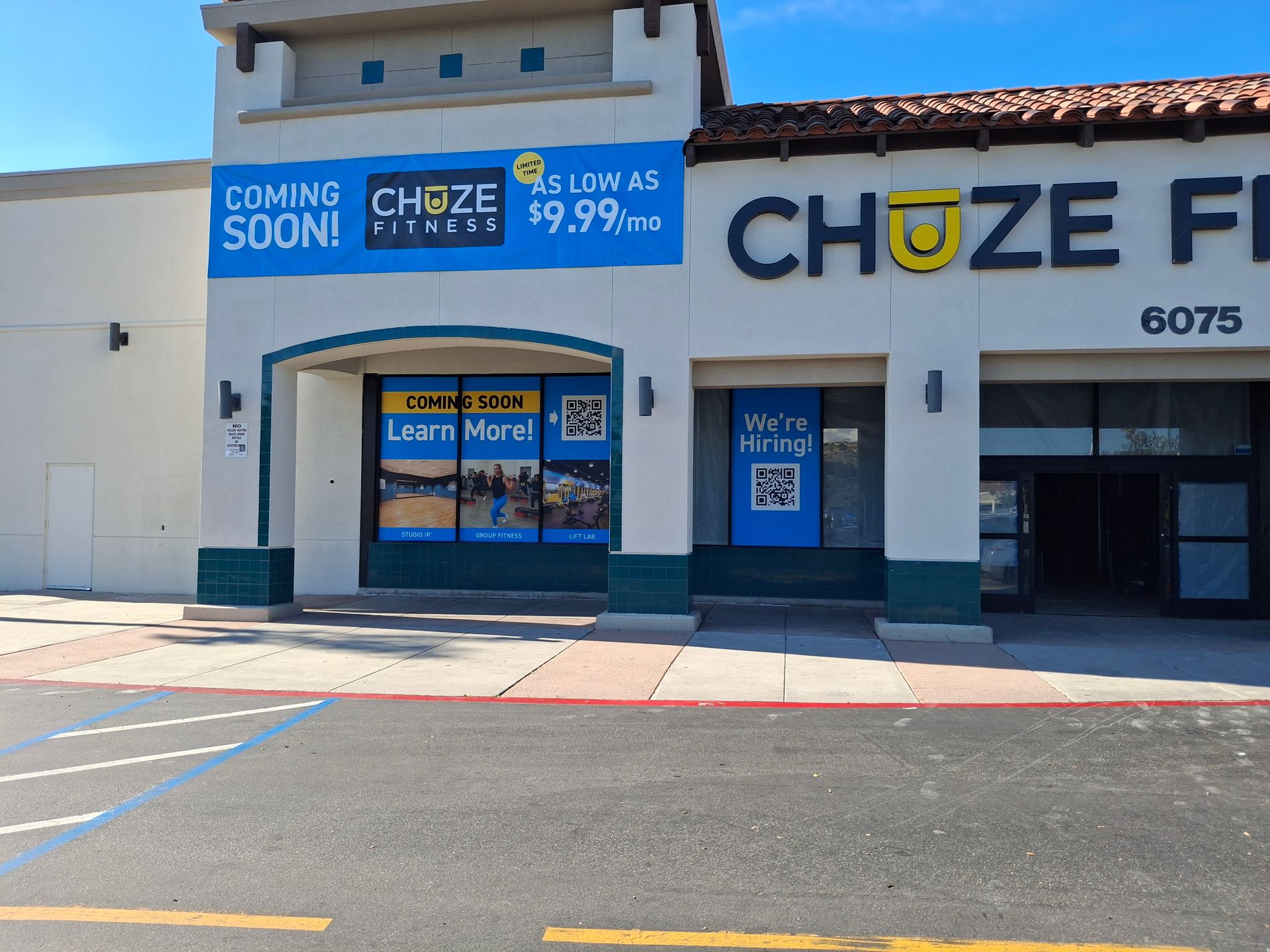 Choze storefront with blue-and-white signage and “Coming Soon” banners on a sunny street