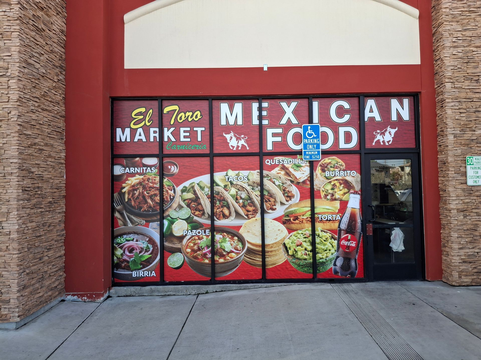 Mexican food market storefront with colorful menu signs and a red archway entrance