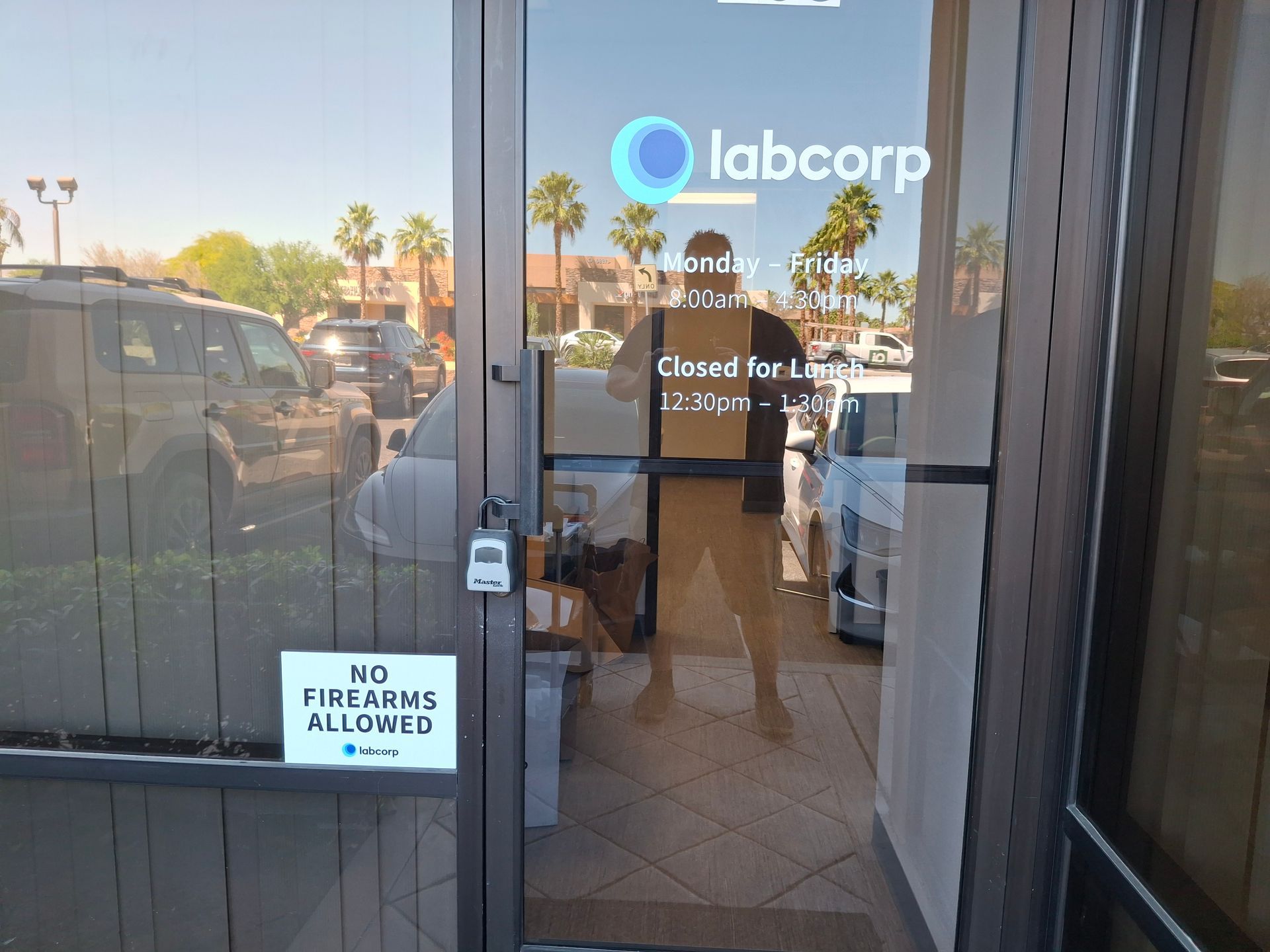 Labcorp clinic entrance with reflective glass doors and a “No deliveries allowed” sign