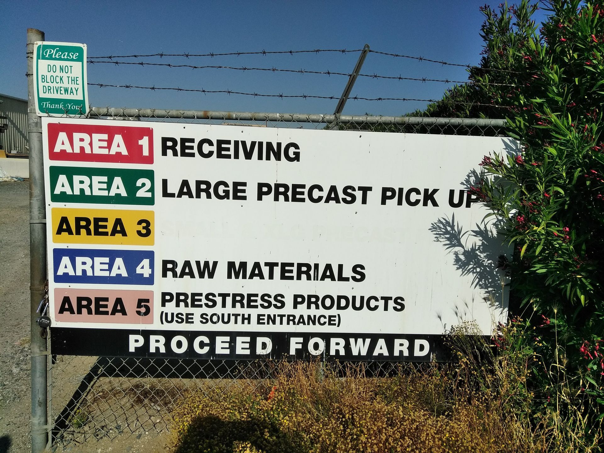 Sign listing warehouse areas 1-5 for receiving, precast pickup, raw materials, and pressed products