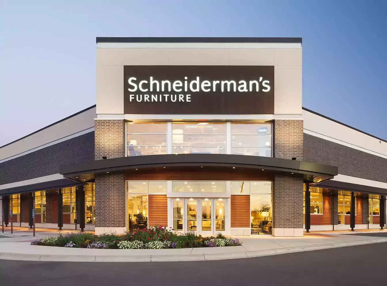 The front of a schneiderman 's furniture store