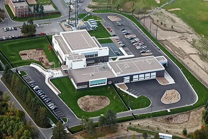 An aerial view of a large building with a lot of parking spaces