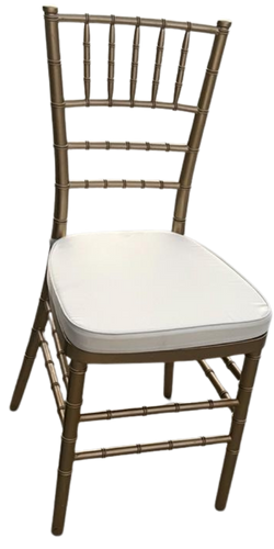 A wooden chair with a white cushion on a white background.