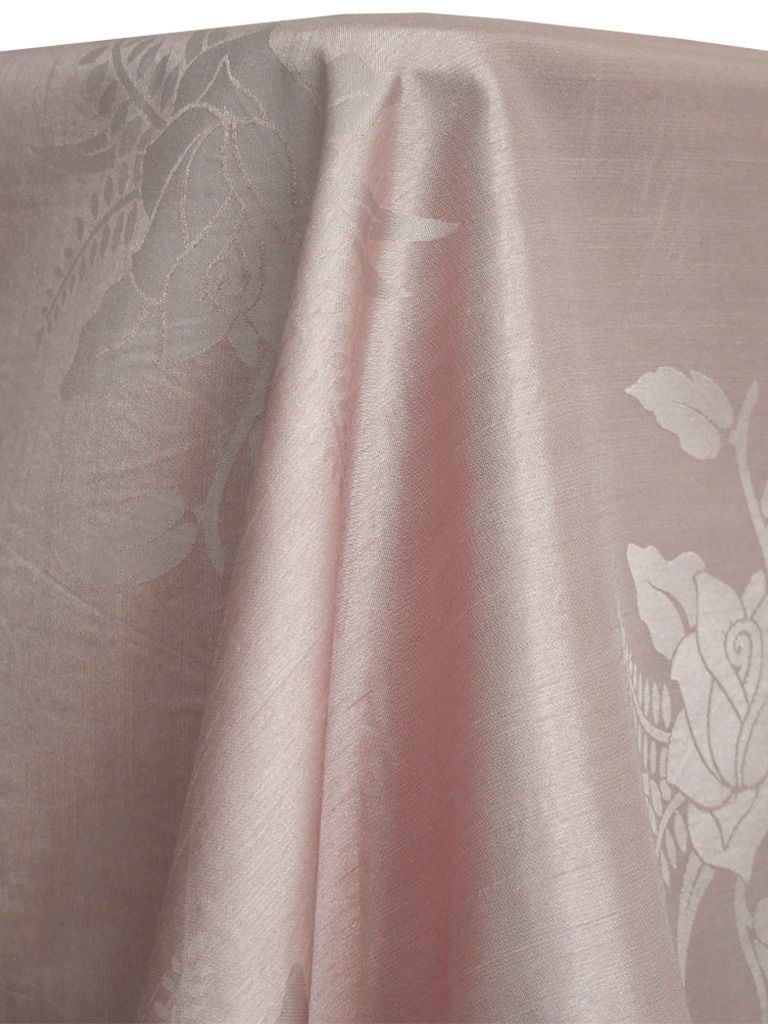 Pink fabric with floral pattern draped over a rounded form.