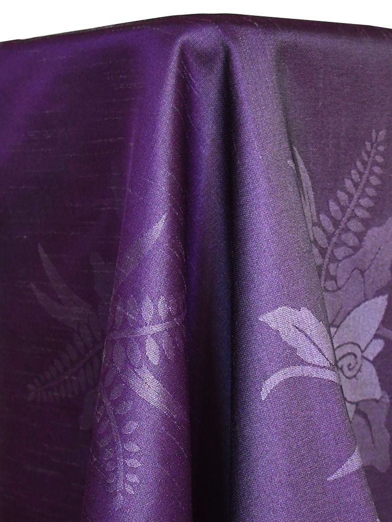 Purple tablecloth with floral pattern.