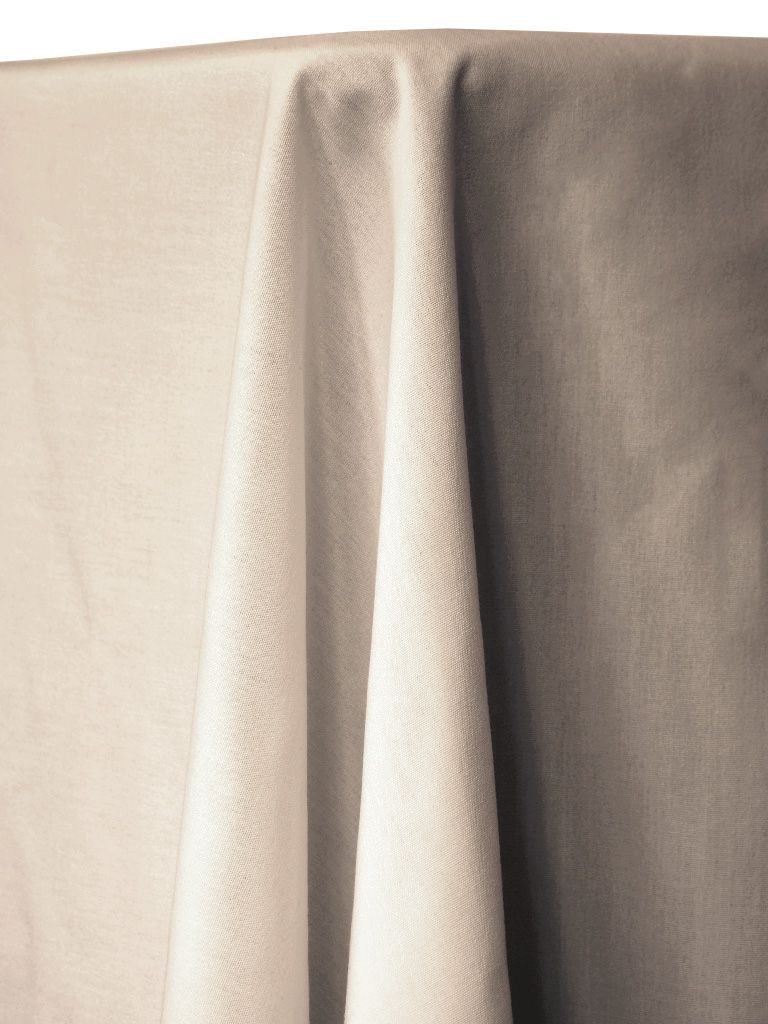 Beige tablecloth draped over a table, with prominent folds and texture.