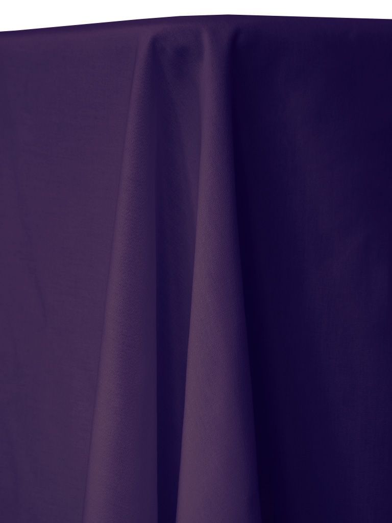 Purple tablecloth draped over a table, with folds and shadows.
