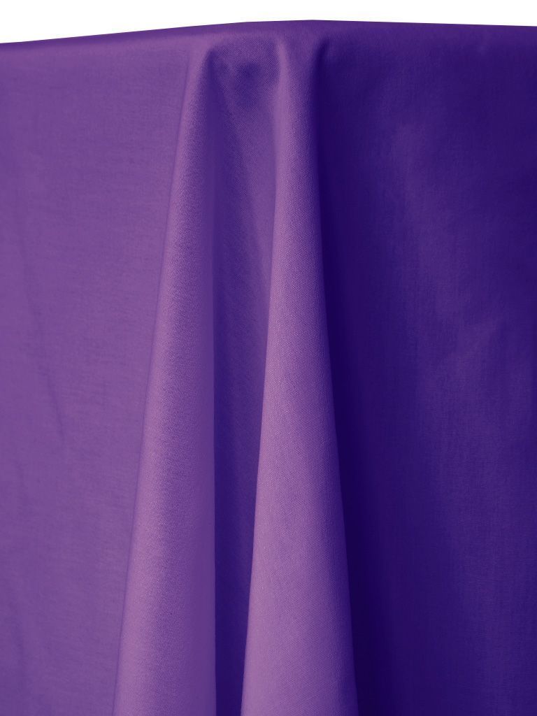 Close-up of a purple tablecloth draped over a table, with folds and shadows.