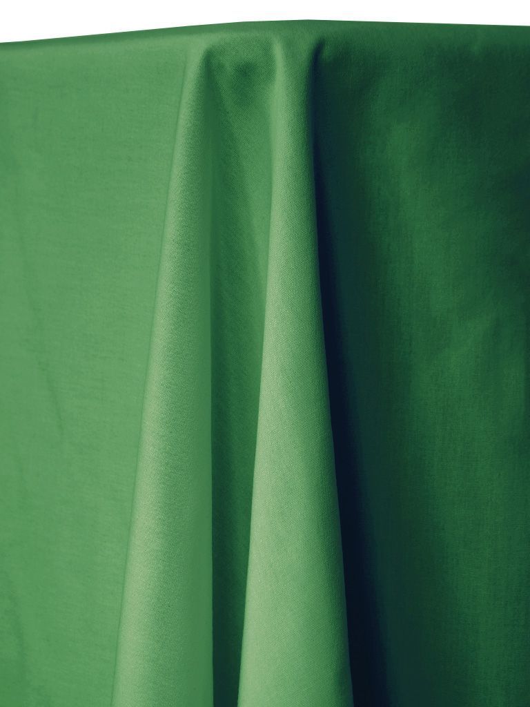 Green tablecloth draped, with visible folds and textures.