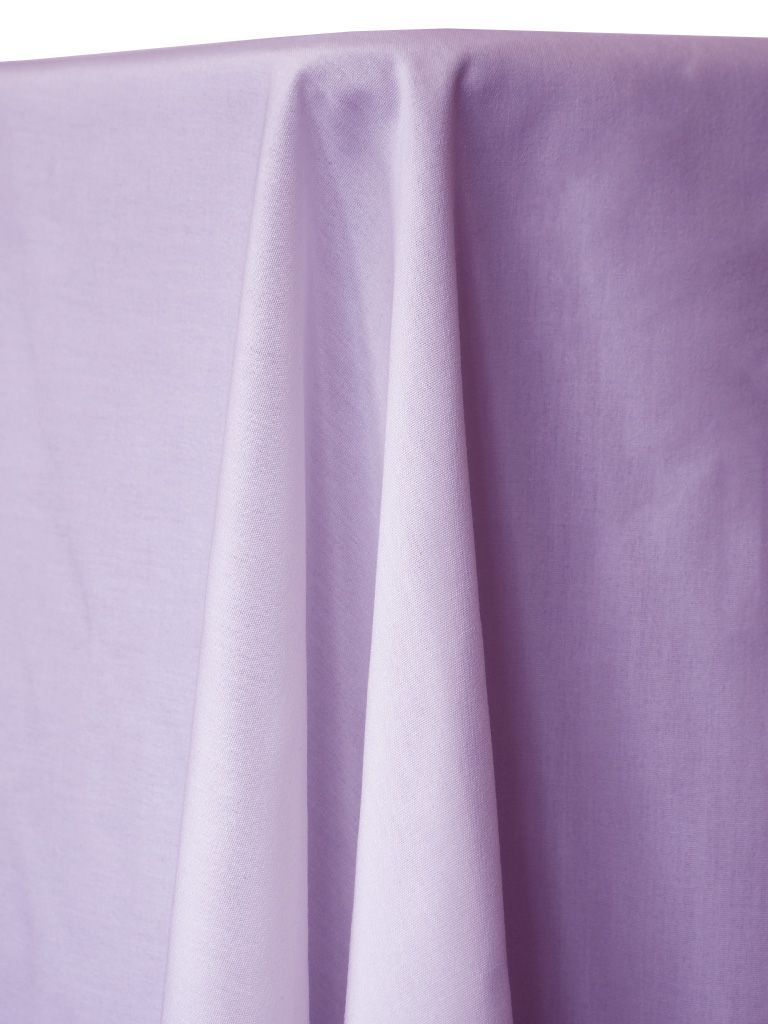 Lavender tablecloth draped, fabric folds.