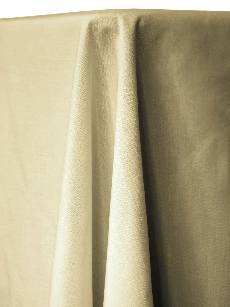 Cream-colored tablecloth draped over a table, with folds and shadows.