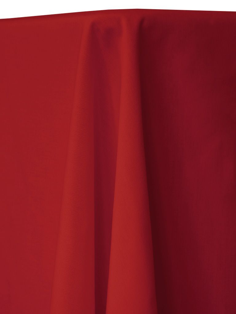 Red tablecloth draped over a table, with folds and shadows.