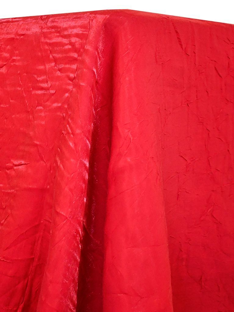 Red textured fabric draped.