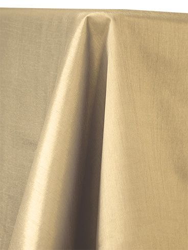 Tan fabric draped, with folds and highlights, likely a tablecloth.