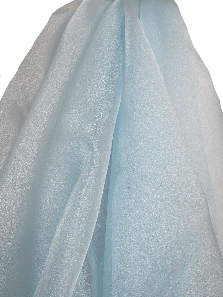 Light blue, sparkly tulle fabric draped and folded.