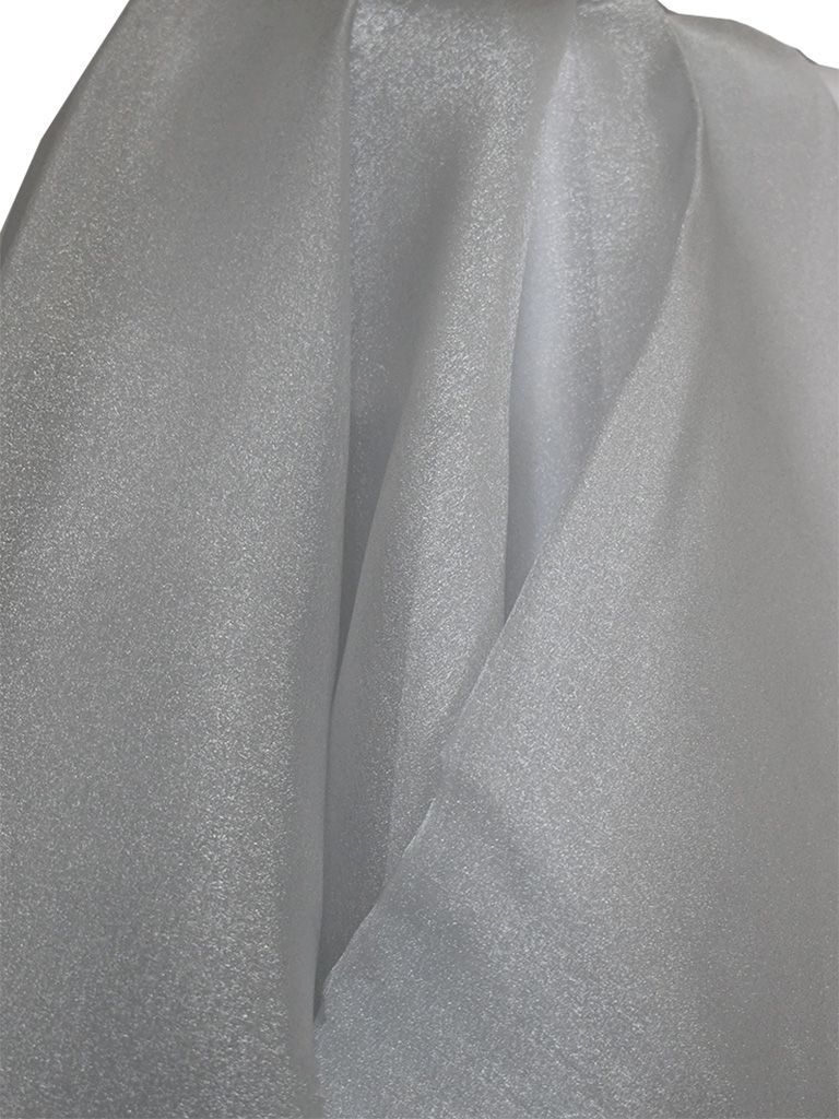 White shimmering fabric, loosely draped and folded, creating texture and highlights.