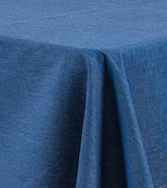 Blue textured tablecloth draped over a table.