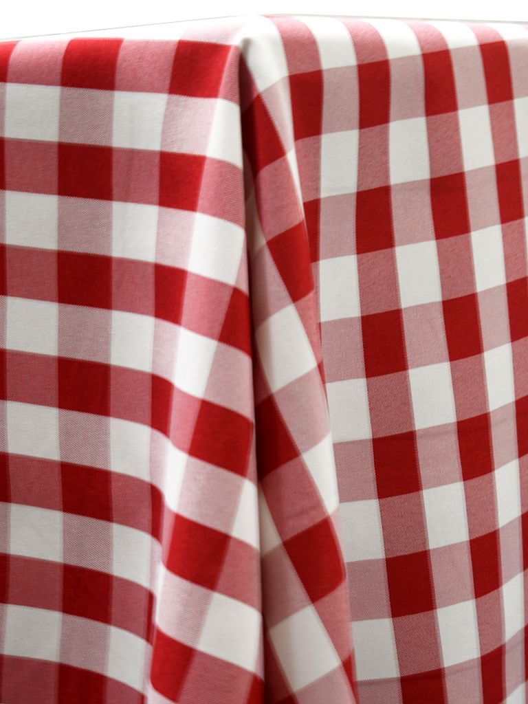 Red and white checkered picnic tablecloth draped over a surface.