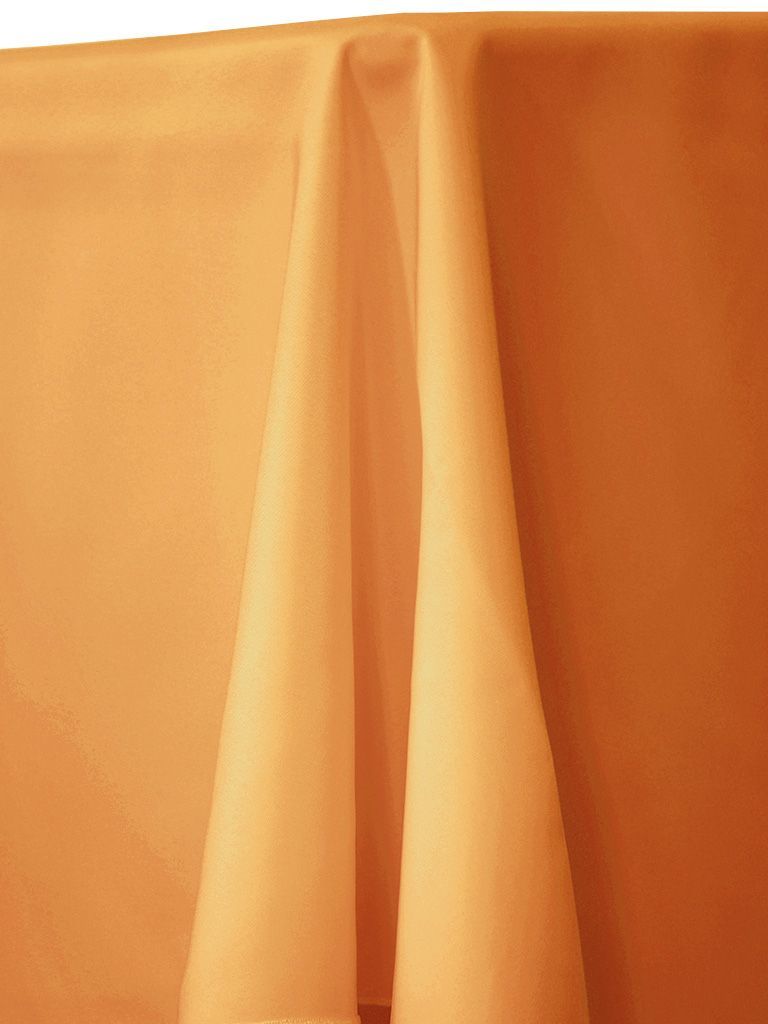 Orange table cloth draped over a table.