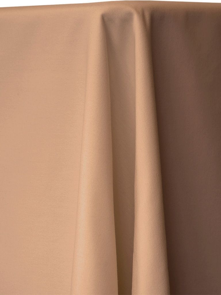 Beige fabric draped over a table.
