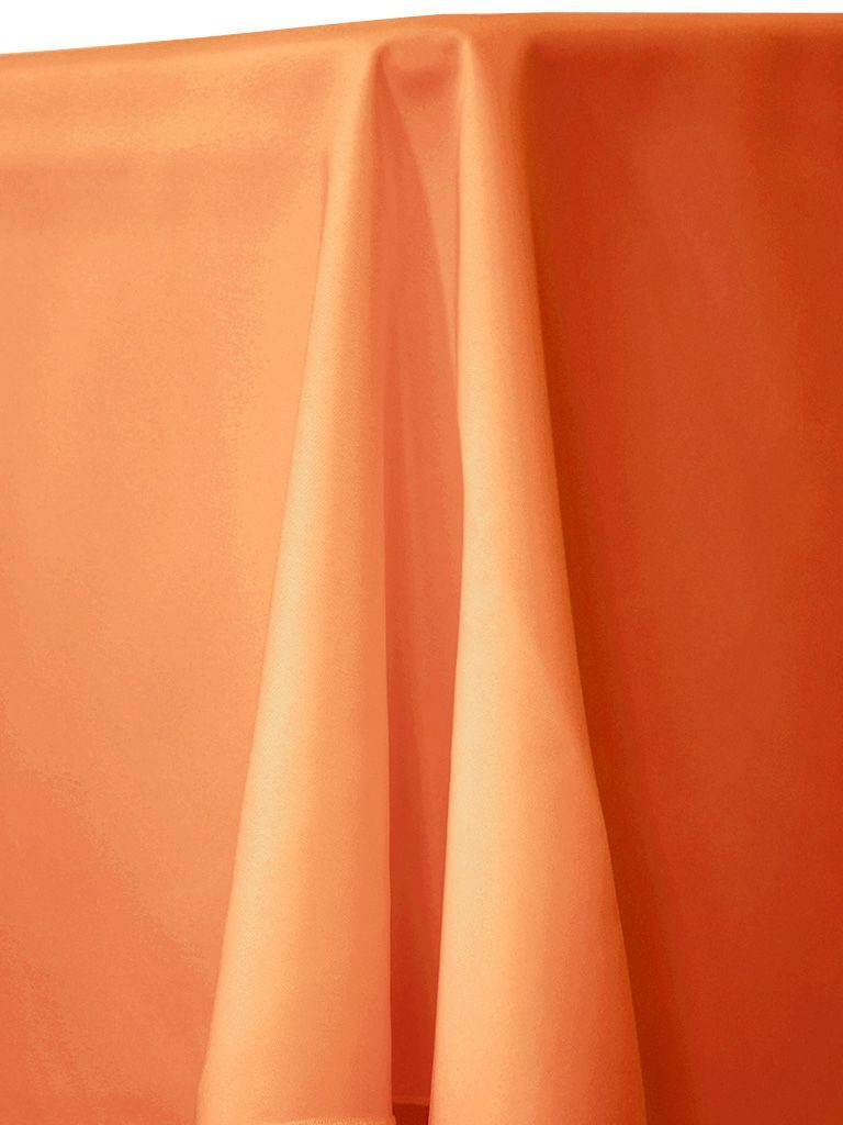 Orange tablecloth draped over a table.