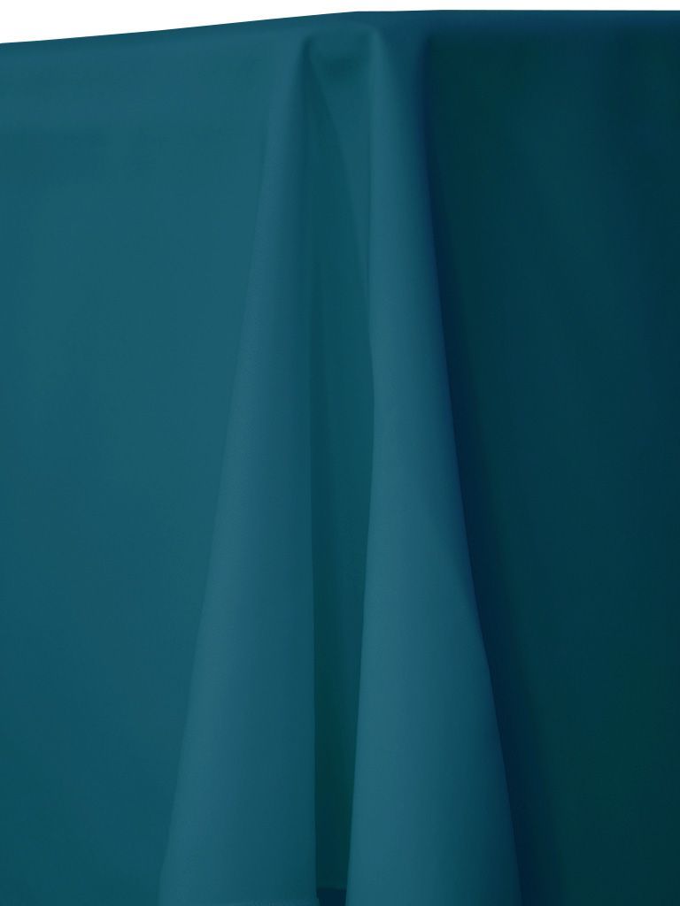 Teal-colored tablecloth draped over a table, with folds and shadows.