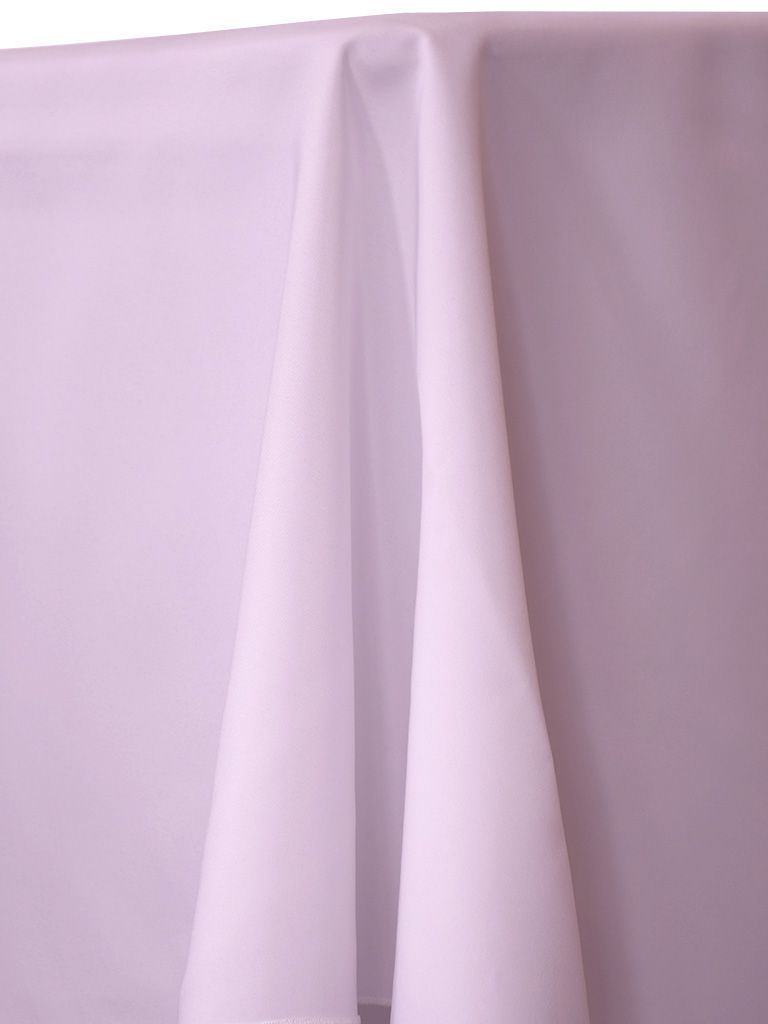 White tablecloth draped over a table, with folds and shadows.