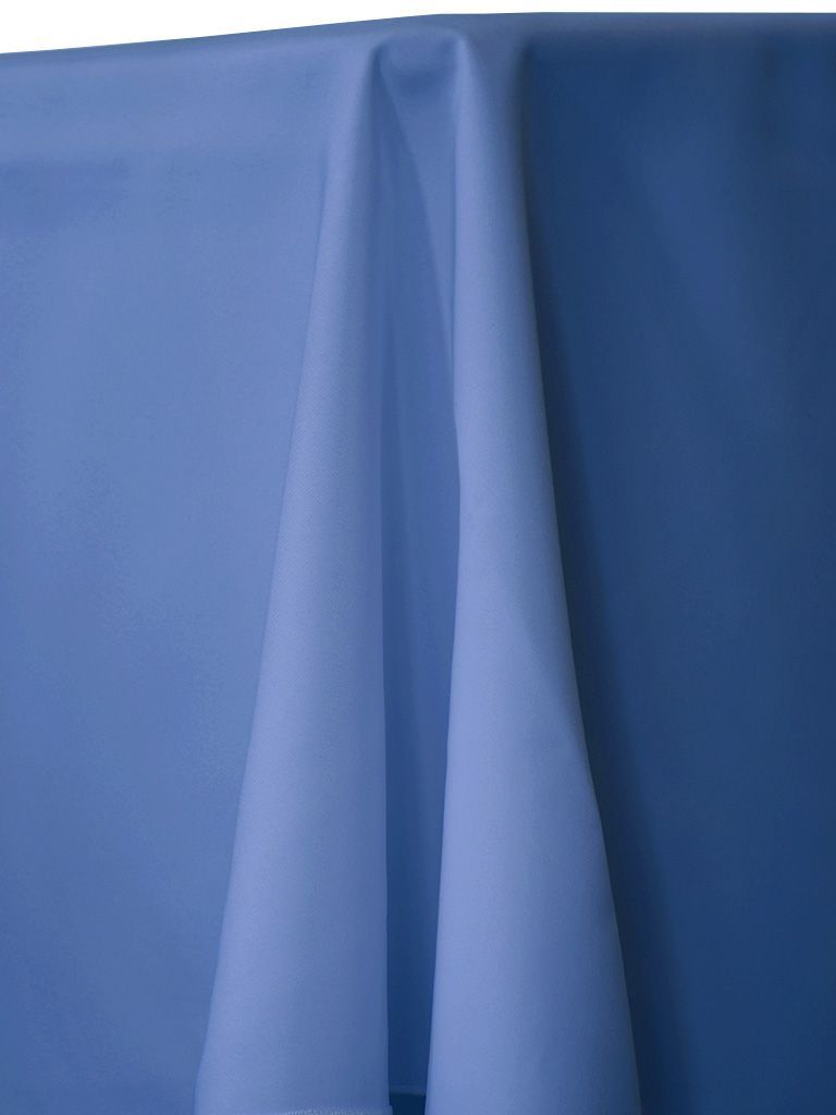 Blue tablecloth draped over a surface, showing folds and shadows.