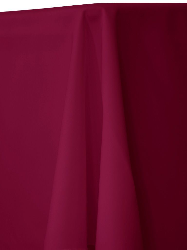 Burgundy tablecloth, draped over a surface, with folds and shadows.