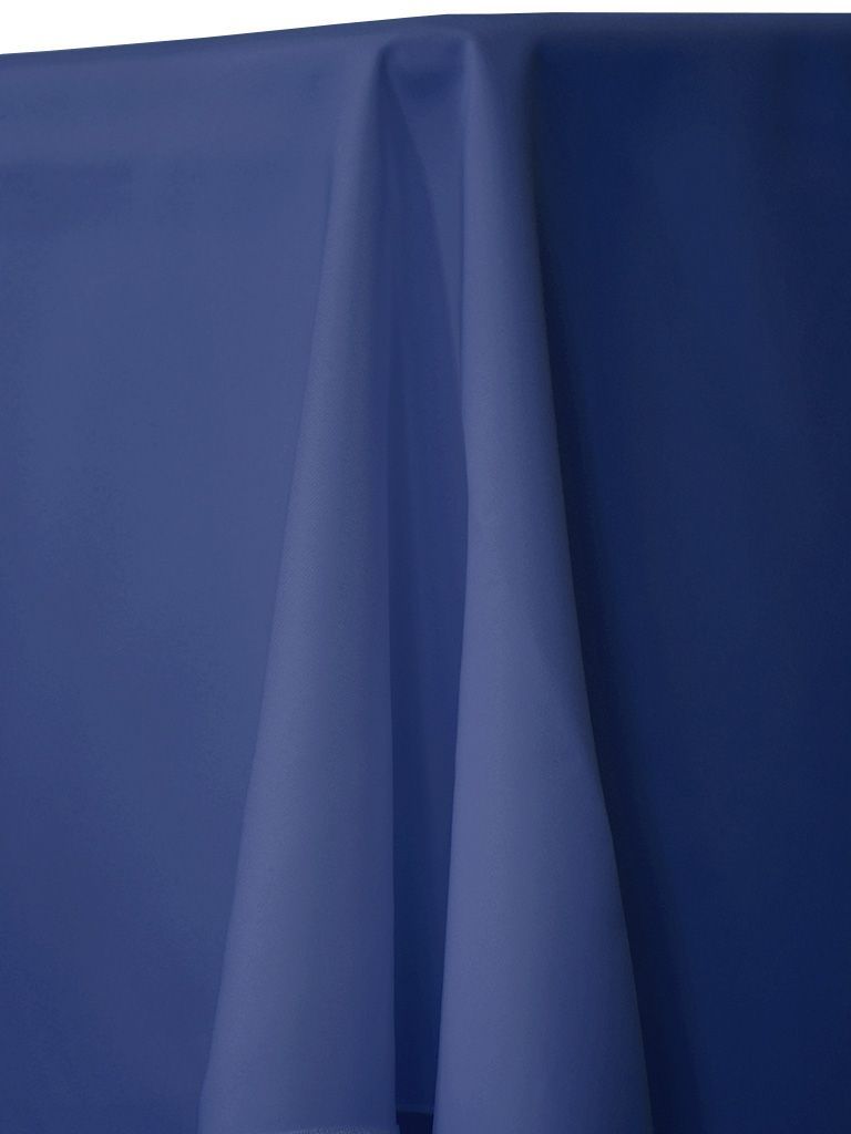 Blue tablecloth with draped fabric.