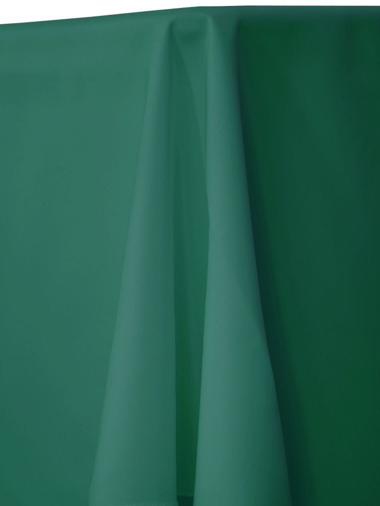 Green fabric draped over a table.