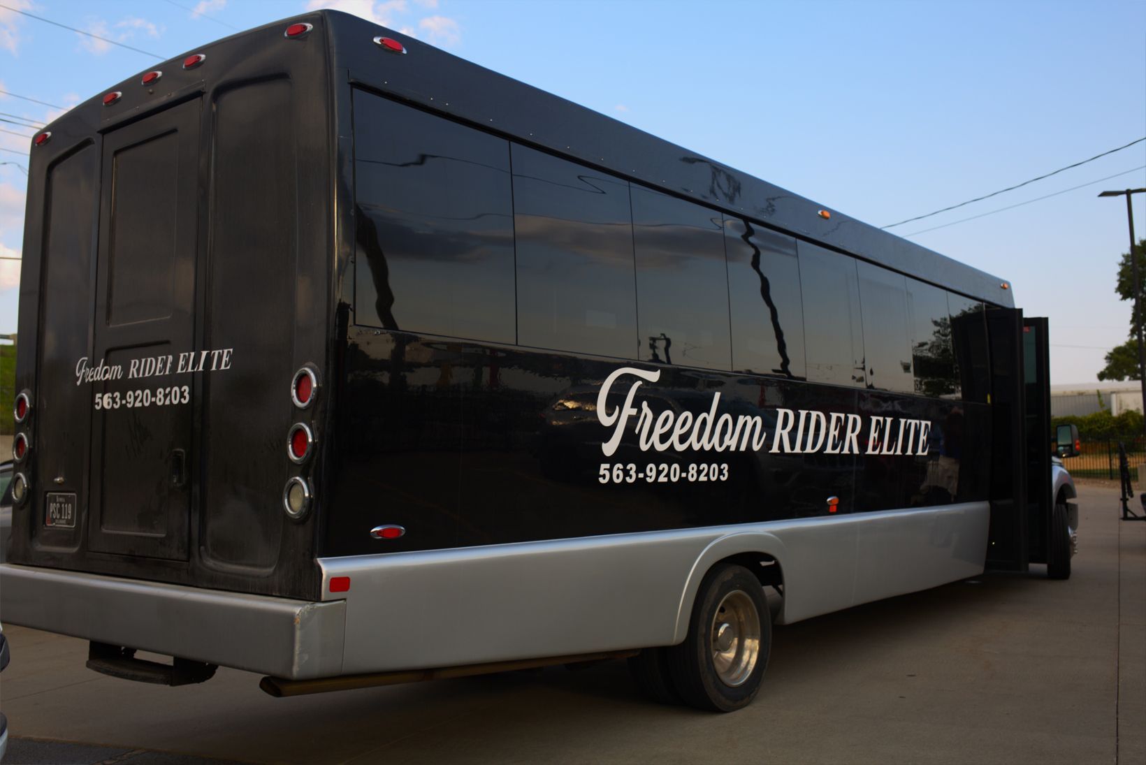 Black party bus with mirrored windows.