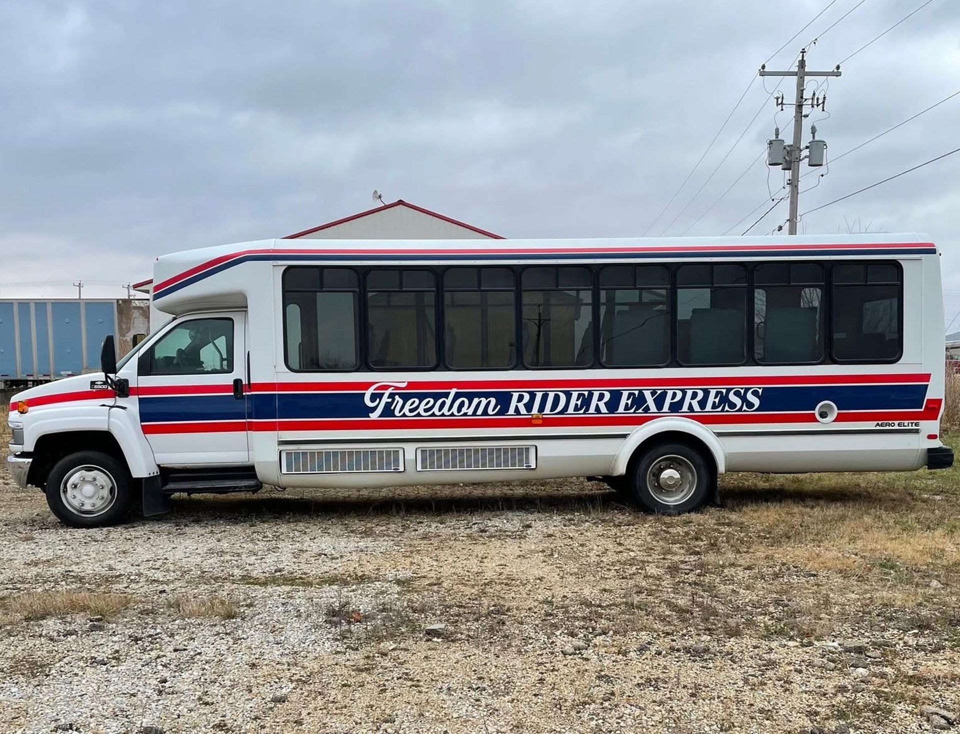 Side view of a white bus, the