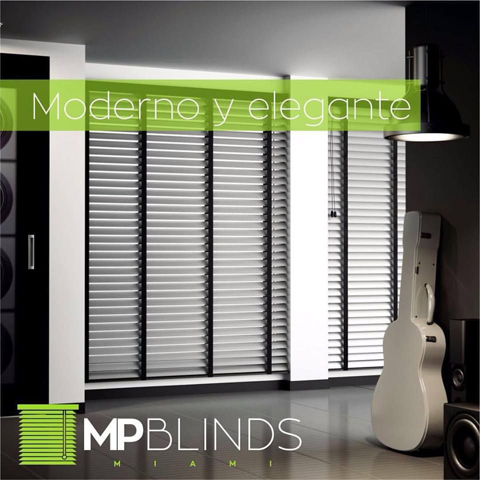 Modern room with blinds, guitar, and speaker; MP Blinds Miami logo.