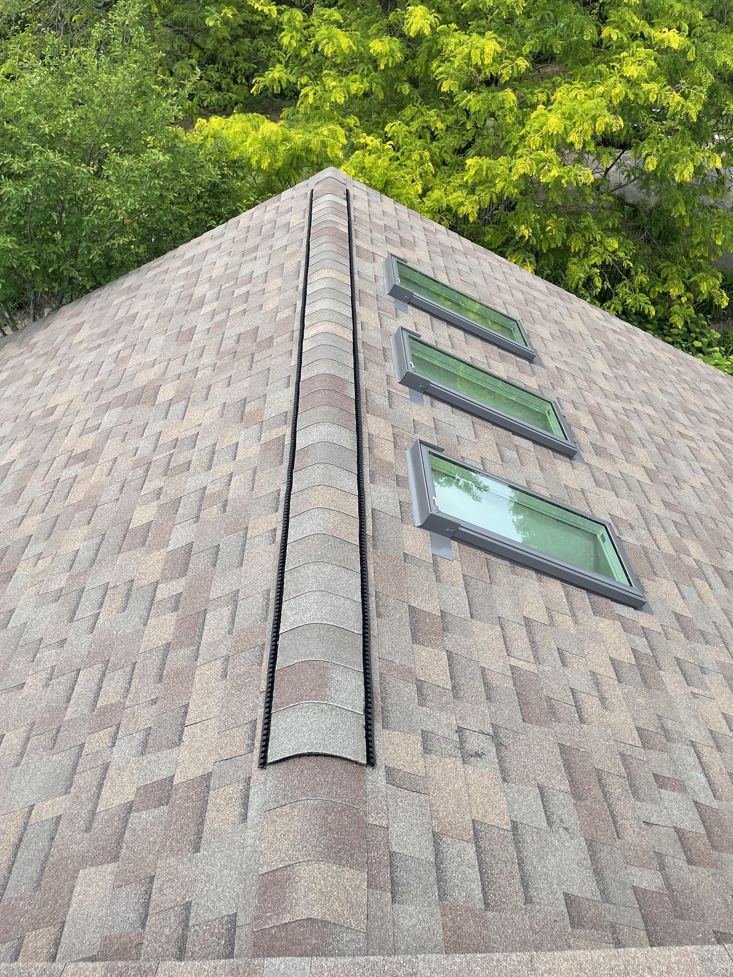 3 skylights installed on a new class 4 shingled roof in West Des Moines, IA.