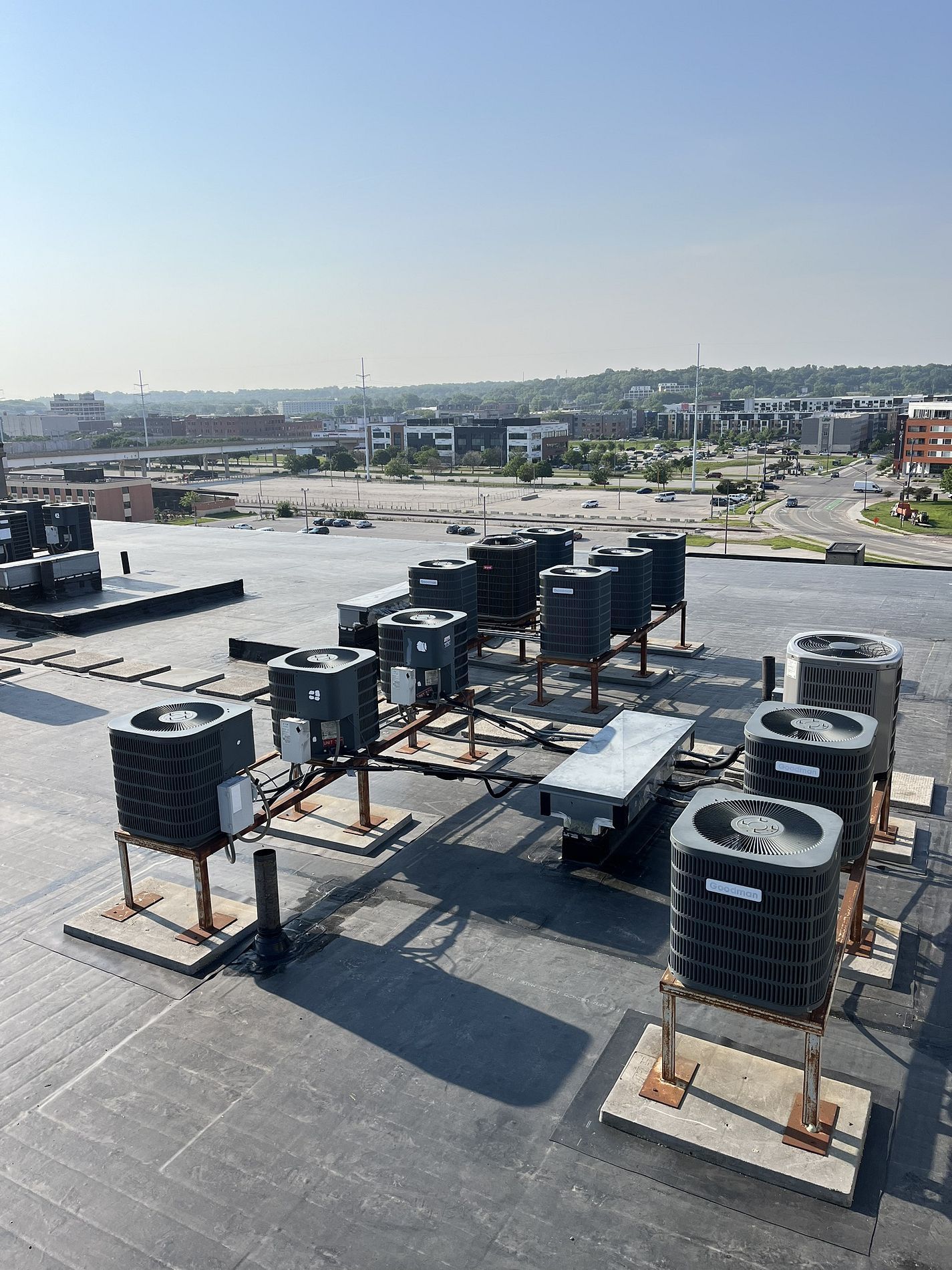 EPDM roof repairs after HVAC maintenance on flat roof in Des Moines, IA.