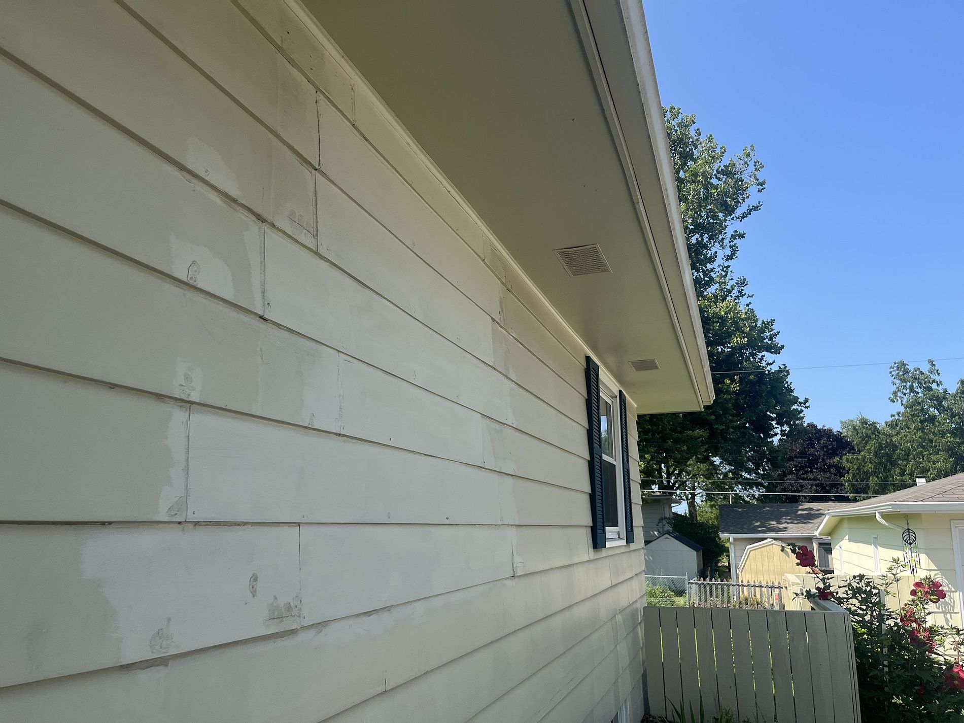 Old siding that is in need of replacement in Ankeny, IA.