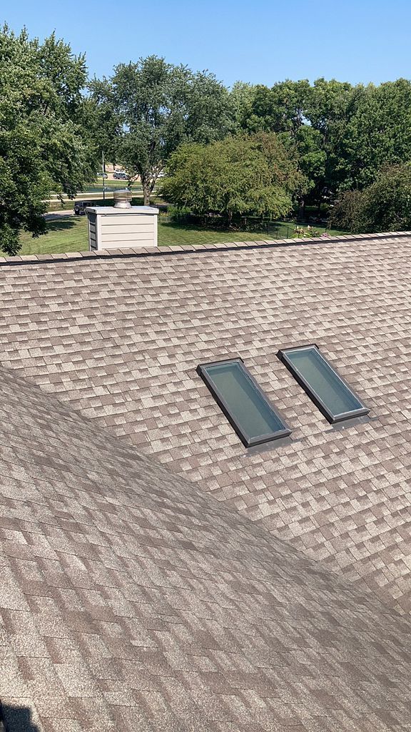 Skylight installed on a new roof after a hail storm in Johnston, IA.