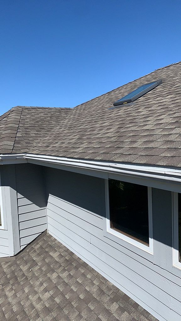 Skylight leak repairs on a shingled roof in Johnston, IA