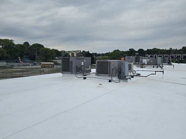 TPO re-roof on strip mall in Des Moines, IA.