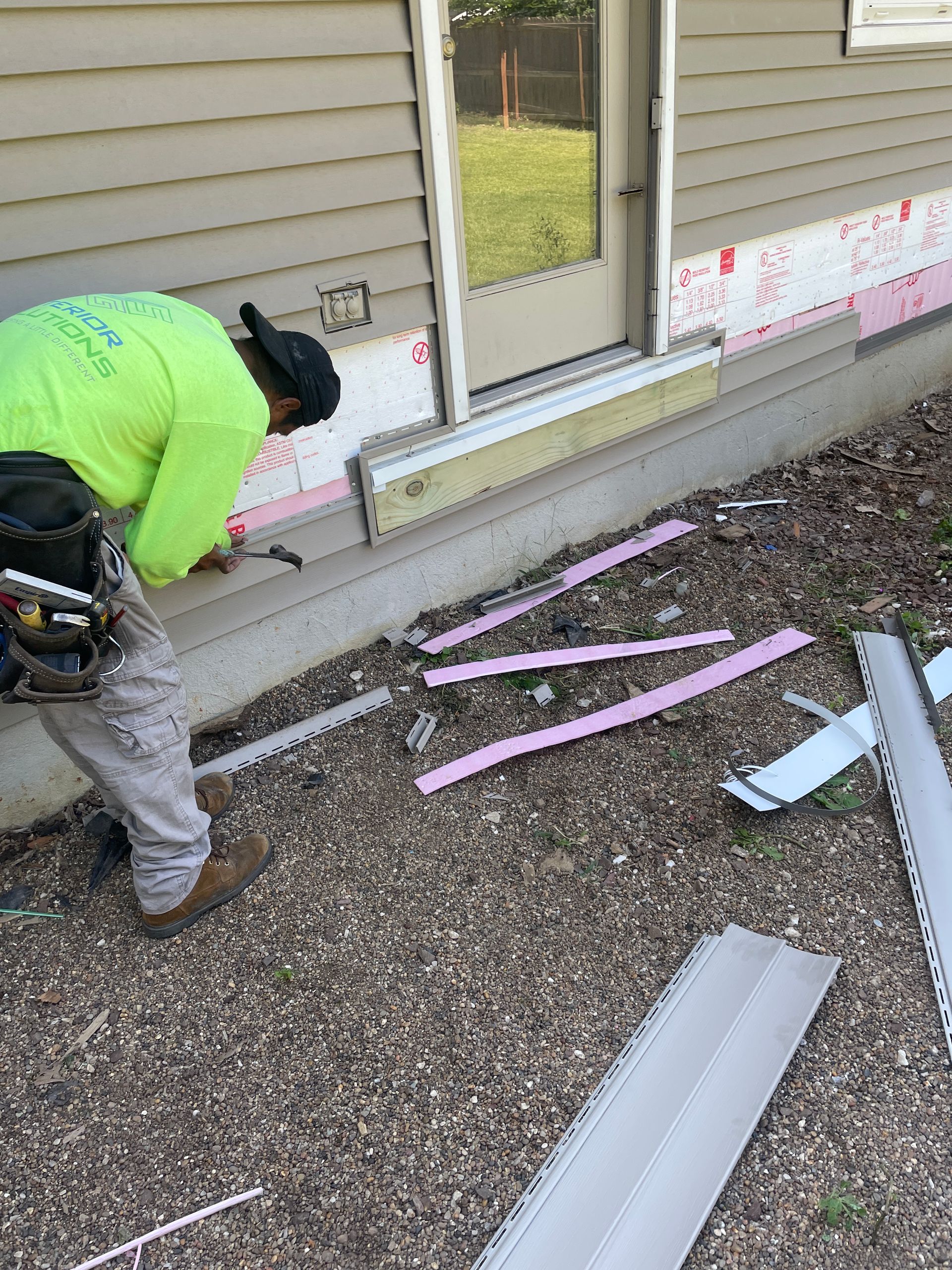 Siding Contractor Repairing the Siding | West Des Moines, IA