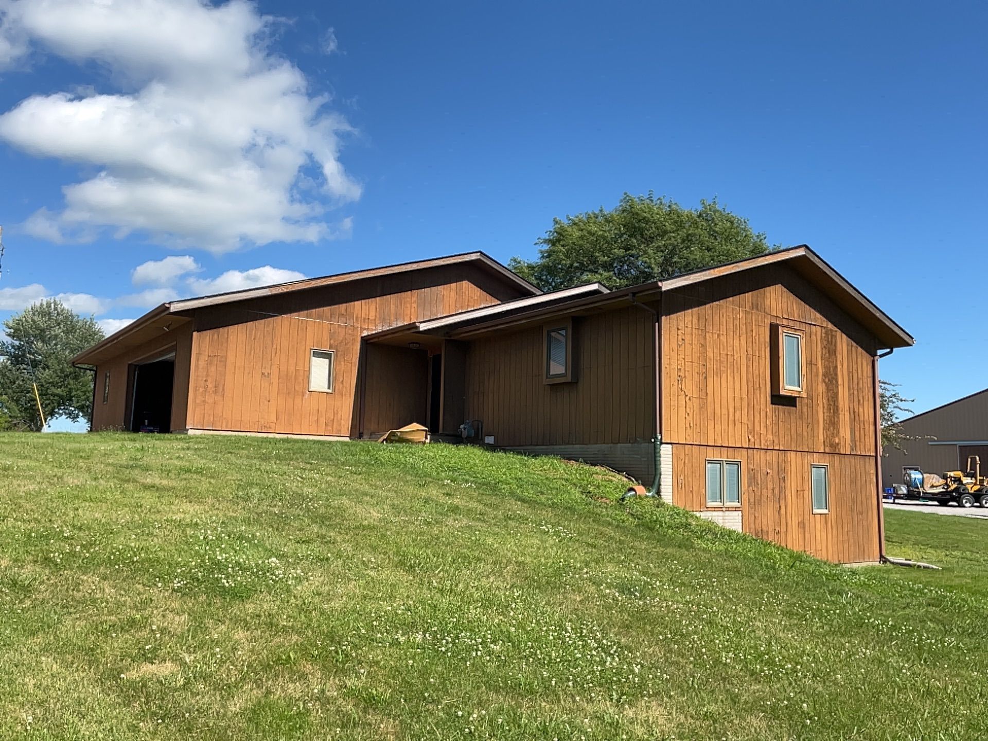 Pella, IA Home Before with old siding