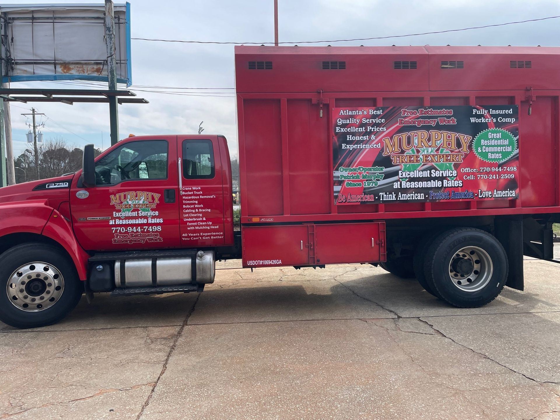 A red truck is parked on the side of the road.
