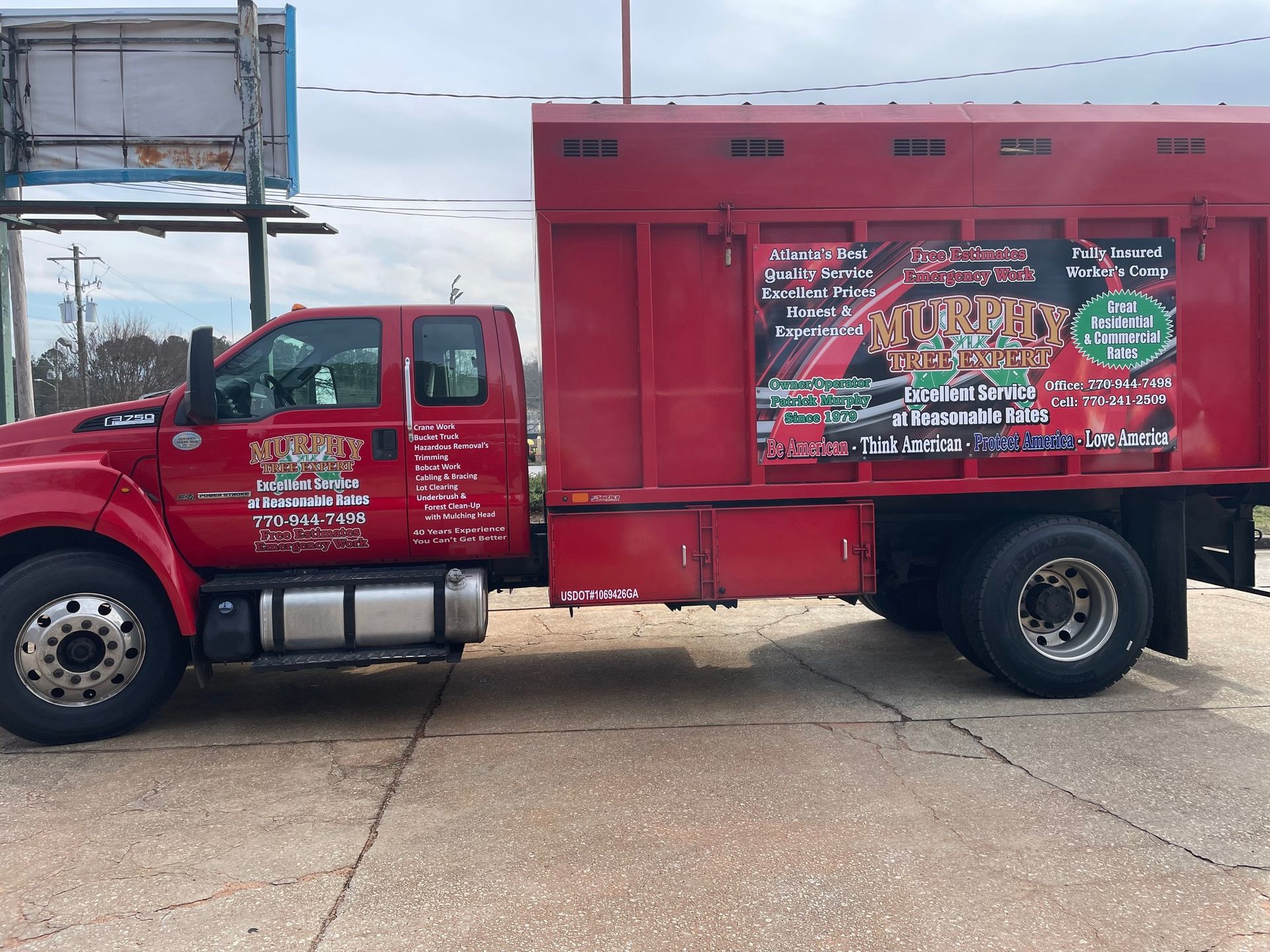 A red truck is parked on the side of the road.