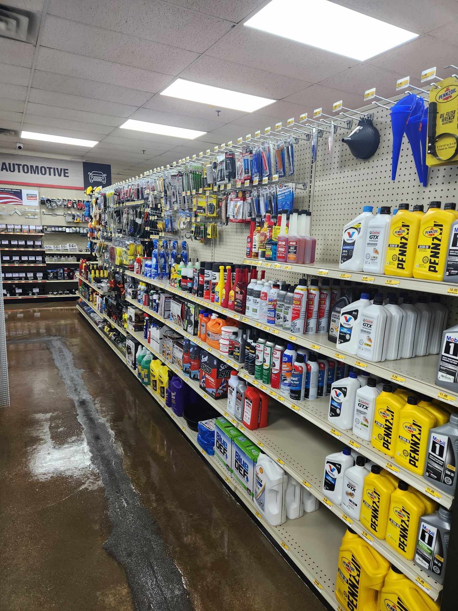 A store aisle filled with shelves filled with lots of products.