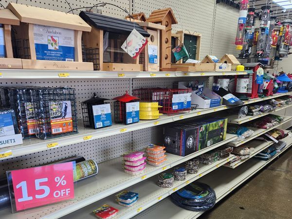 Shelves in a store with a sign that says 15% off