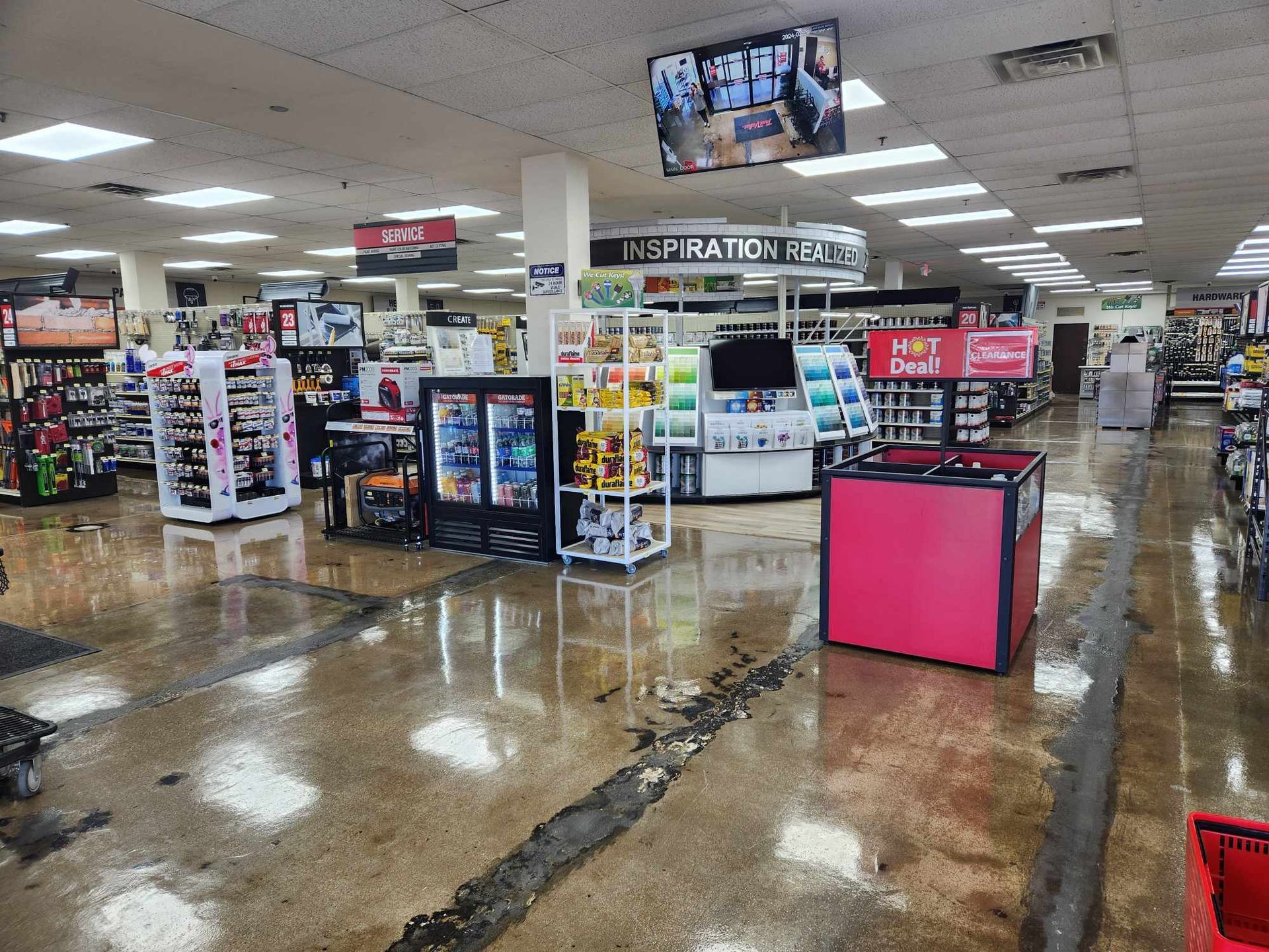 a large store with a lot of shelves and a pink table in the middle