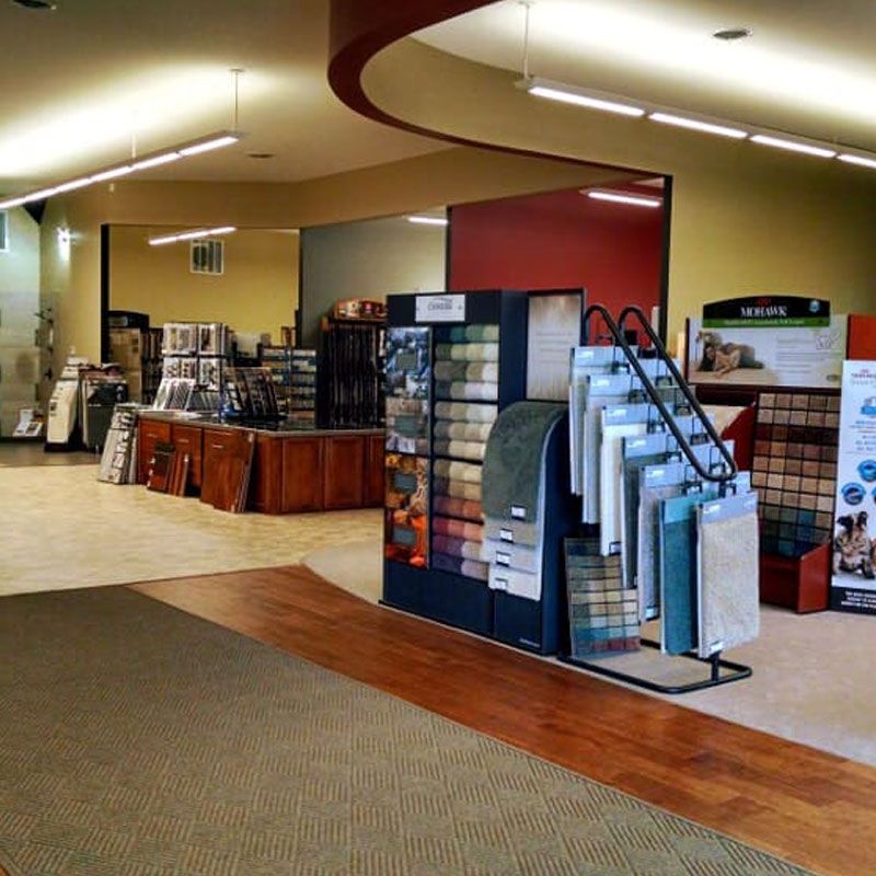 A store filled with lots of carpets and rugs